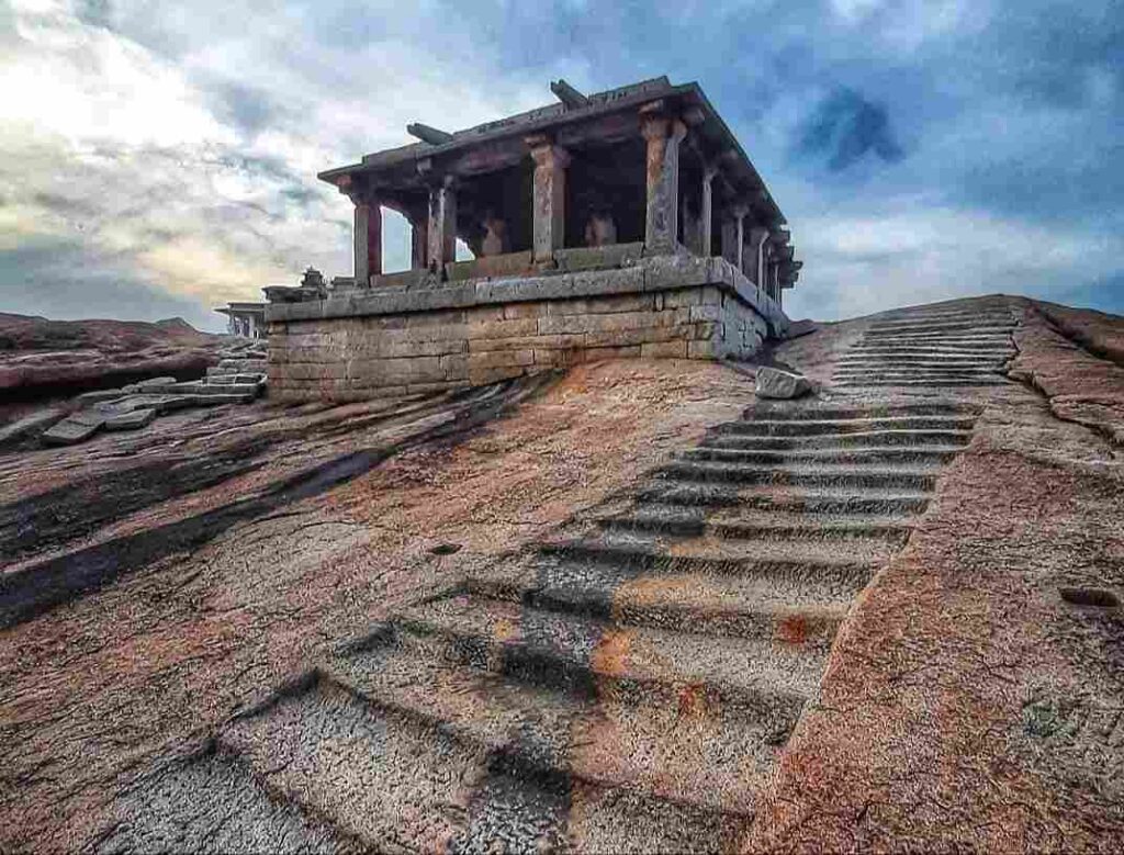 A view of the hill with steps being carved into it