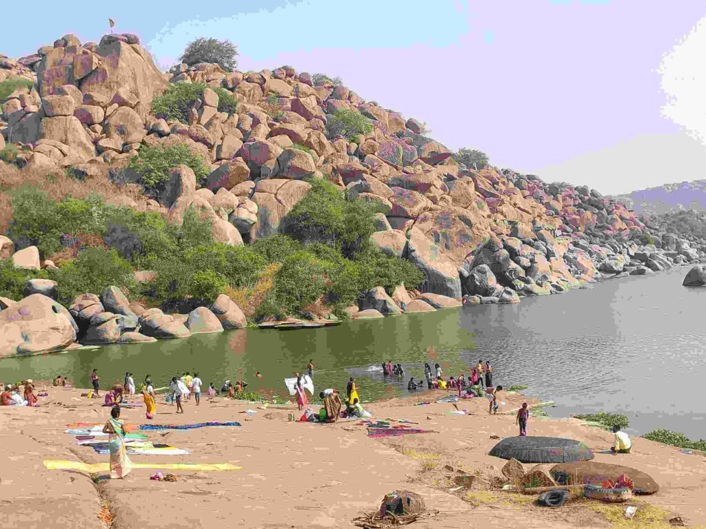 Devotees taking a holy bath in the Tungabhadra river at Chakratirtha