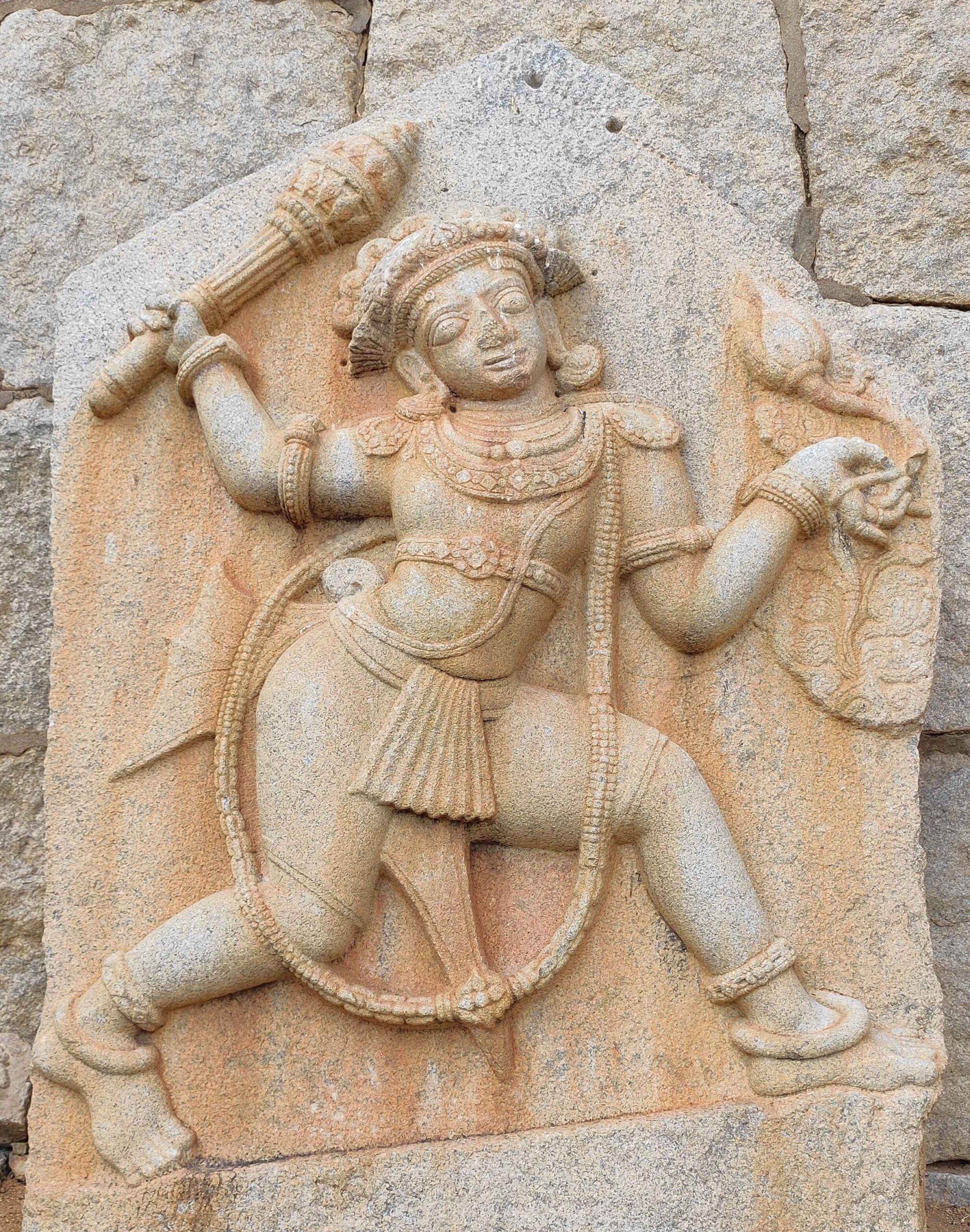 Eight-feet-high figure of Bhima carved on a stone slab