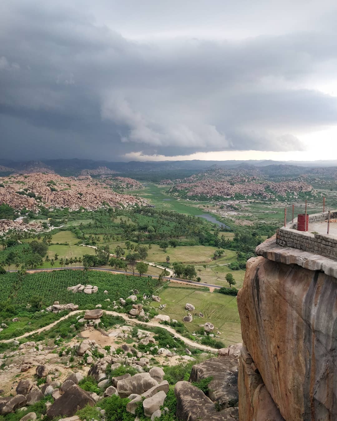 From Anjanadri Hill, watch the first rain of the monsoon