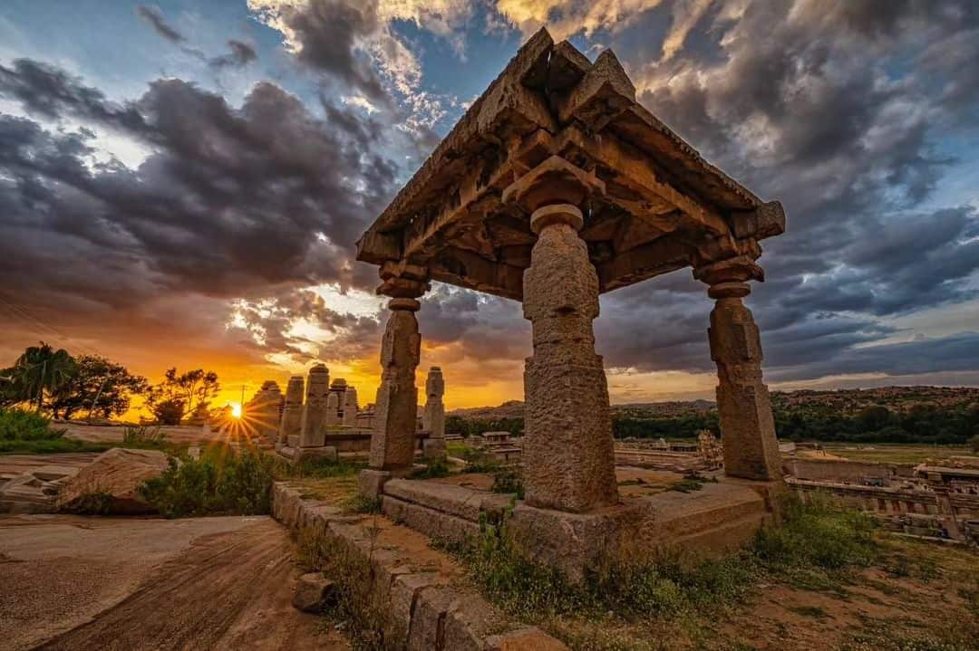 Golden hour in Hampi, where the sunset fills the sky with hues of magic