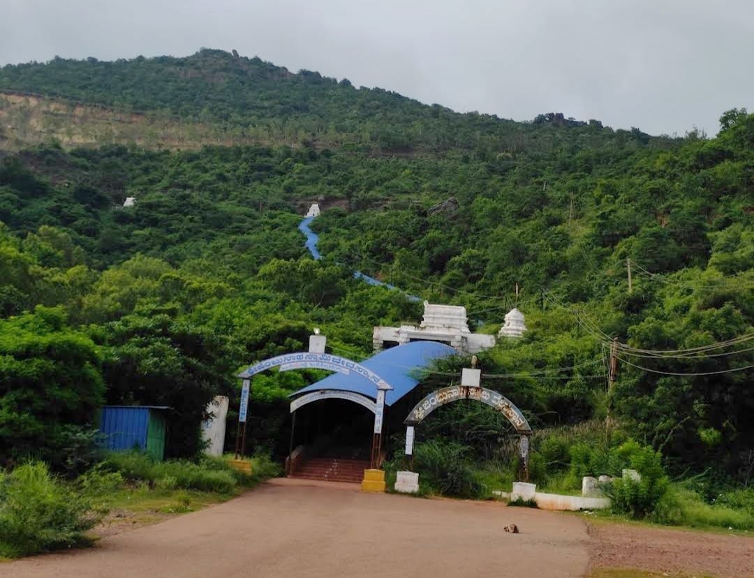 Jambunatha Temple entrance with a blue roof and stairs going up a hill