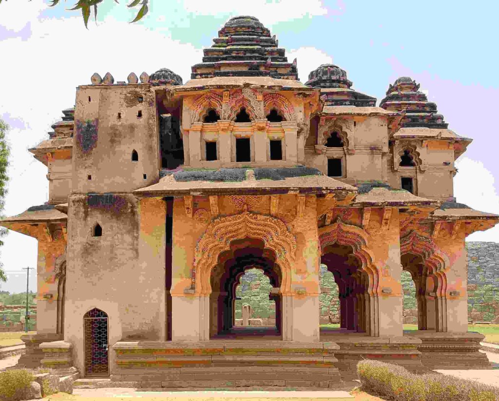 This picture of Lotus Mahal also includes a small room-like structure with stairs leading to the second floor