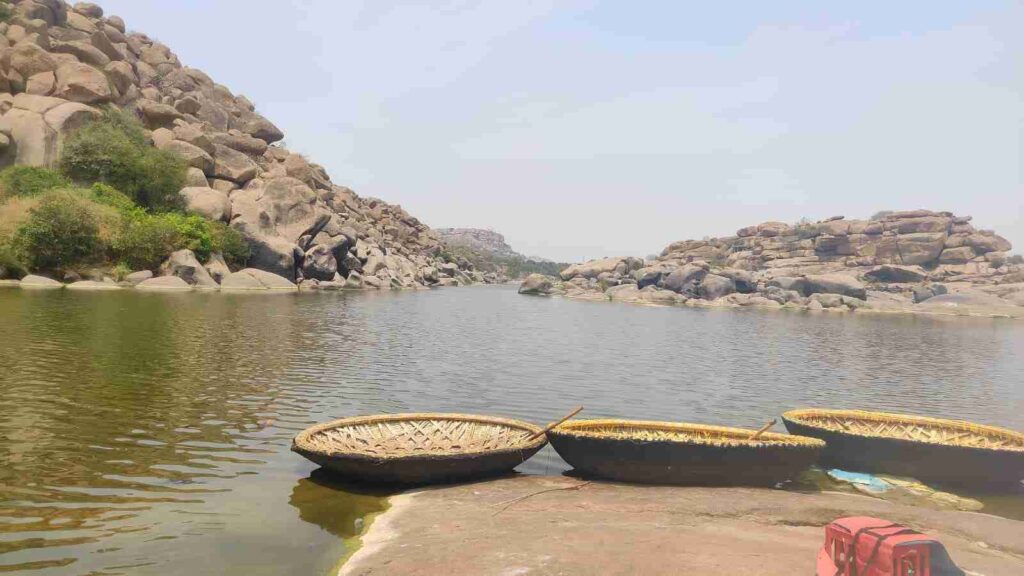 Round, woven-bamboo boats resting on the shore of the Tungabhadra River near Chakratirtha, Hampi