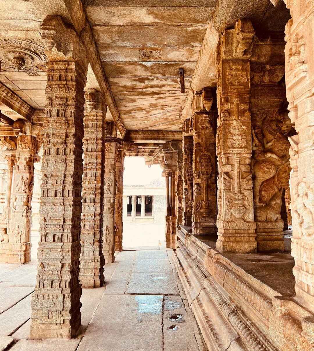 Tall monolithic pillars at the Kalyana Mandapa