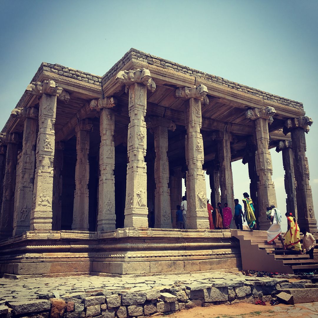 In front of the temple sanctum stands a tall and beautiful stone-pillared mandapam