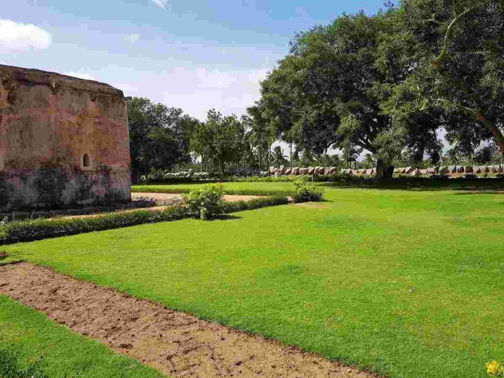 The lush green ground surrounding the Queen's Bath