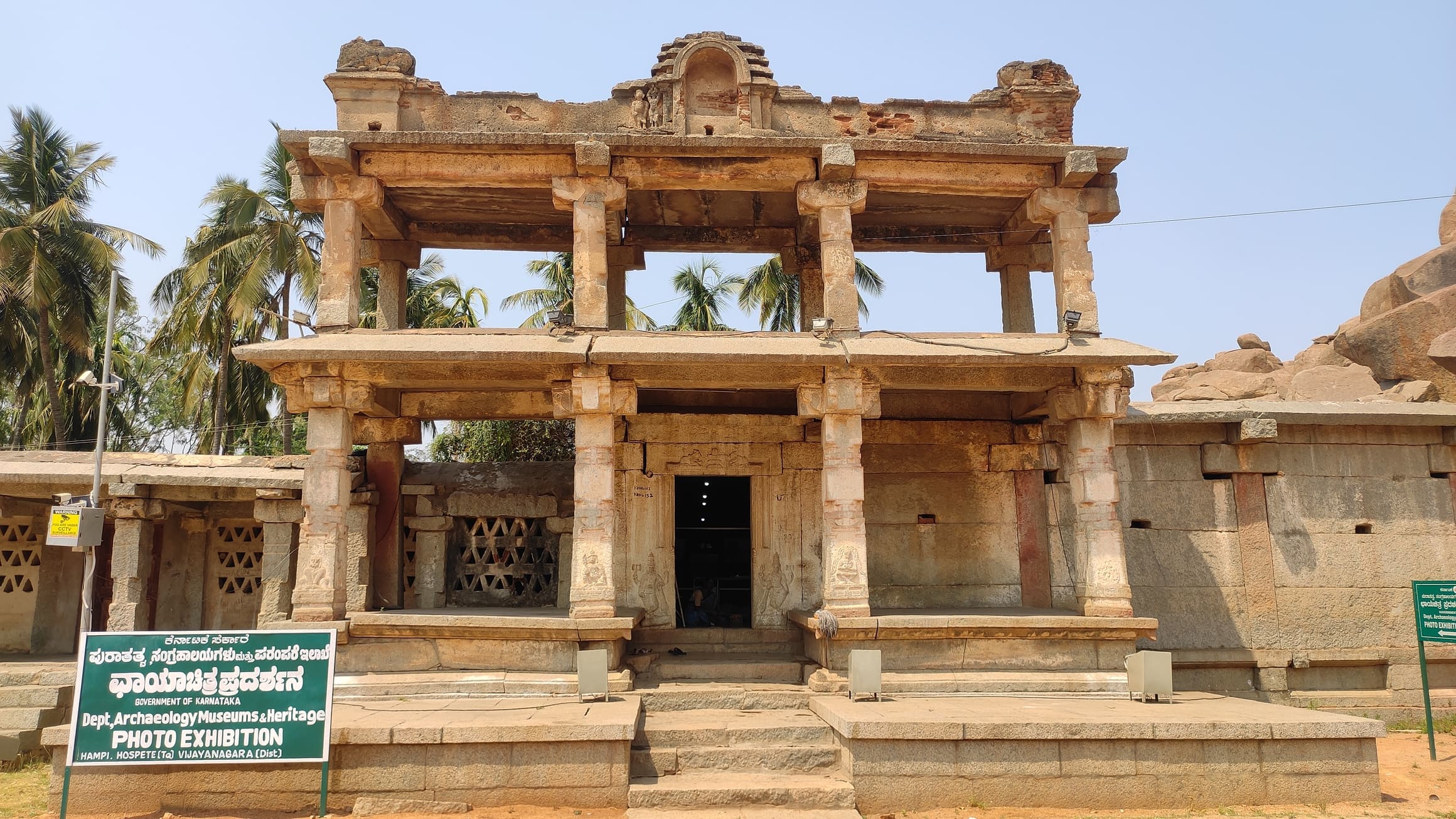 Two-story pavilion hosting a photo exhibition in Hampi bazaar