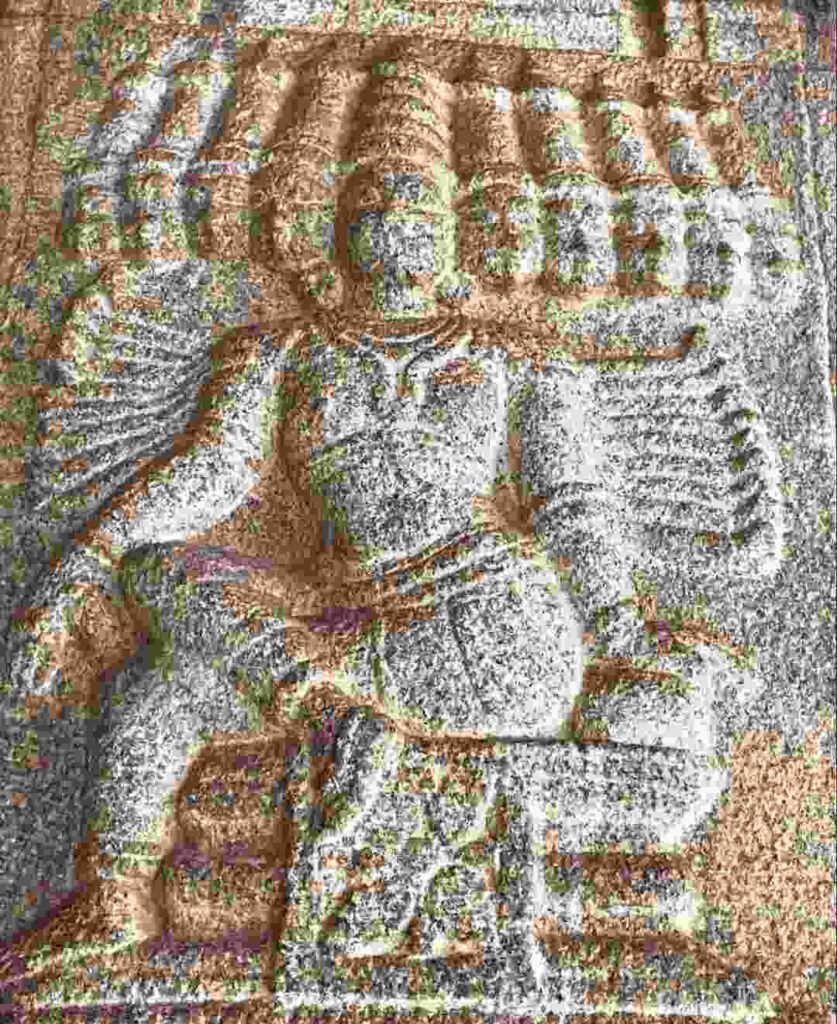 A small sculpture of ten-headed Ravanasura carved on a pillar